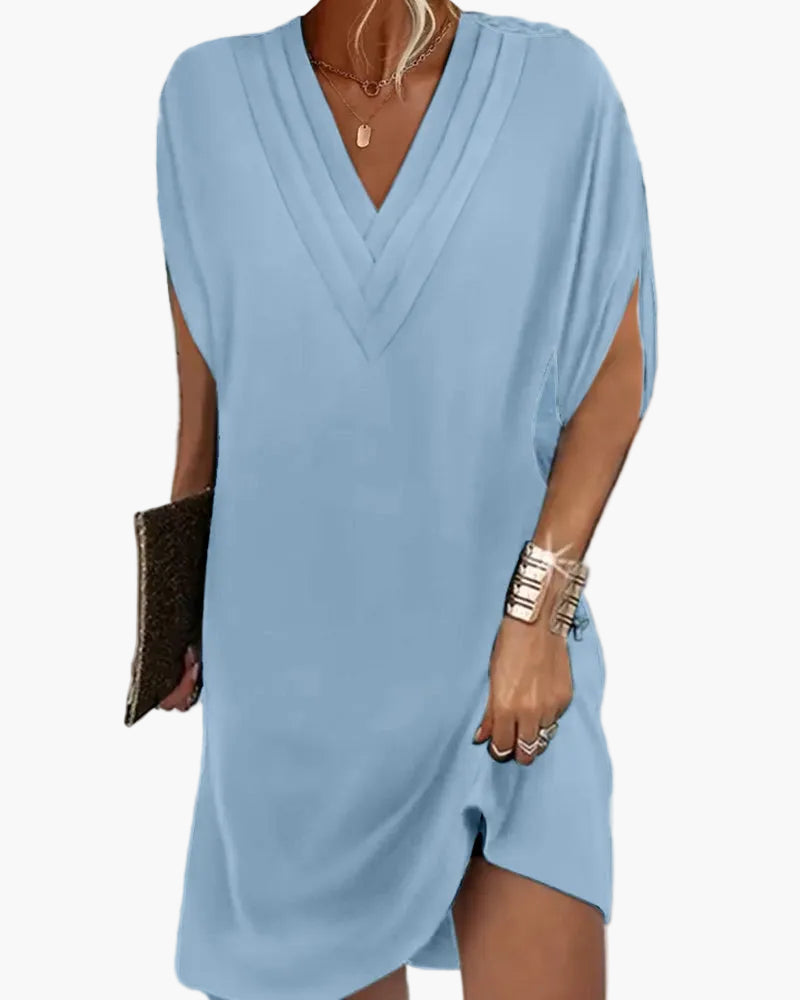 Damska sukienka casual z dekoltem w serek i rozciętymi rękawami, styl elegancki na każdą okazję