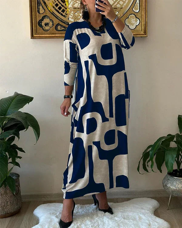 Lynda – Robe Maxi Fluide avec Imprimé Art Audacieux et Design Élégant Sans Manches