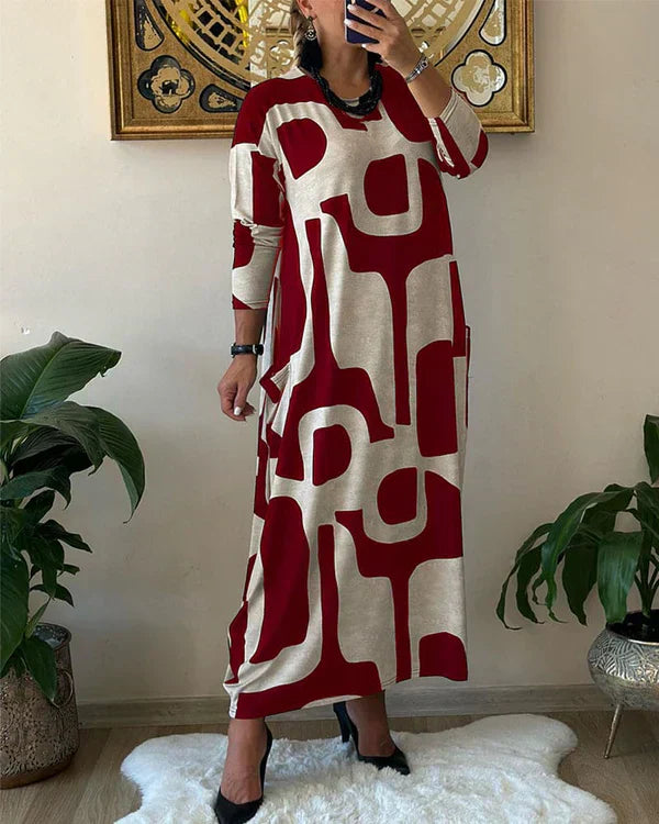 Lynda – Robe Maxi Fluide avec Imprimé Art Audacieux et Design Élégant Sans Manches