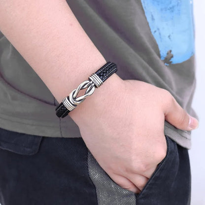 Charlie – Bracelet en cuir tressé pour homme avec nœud infini et fermoir en acier inoxydable