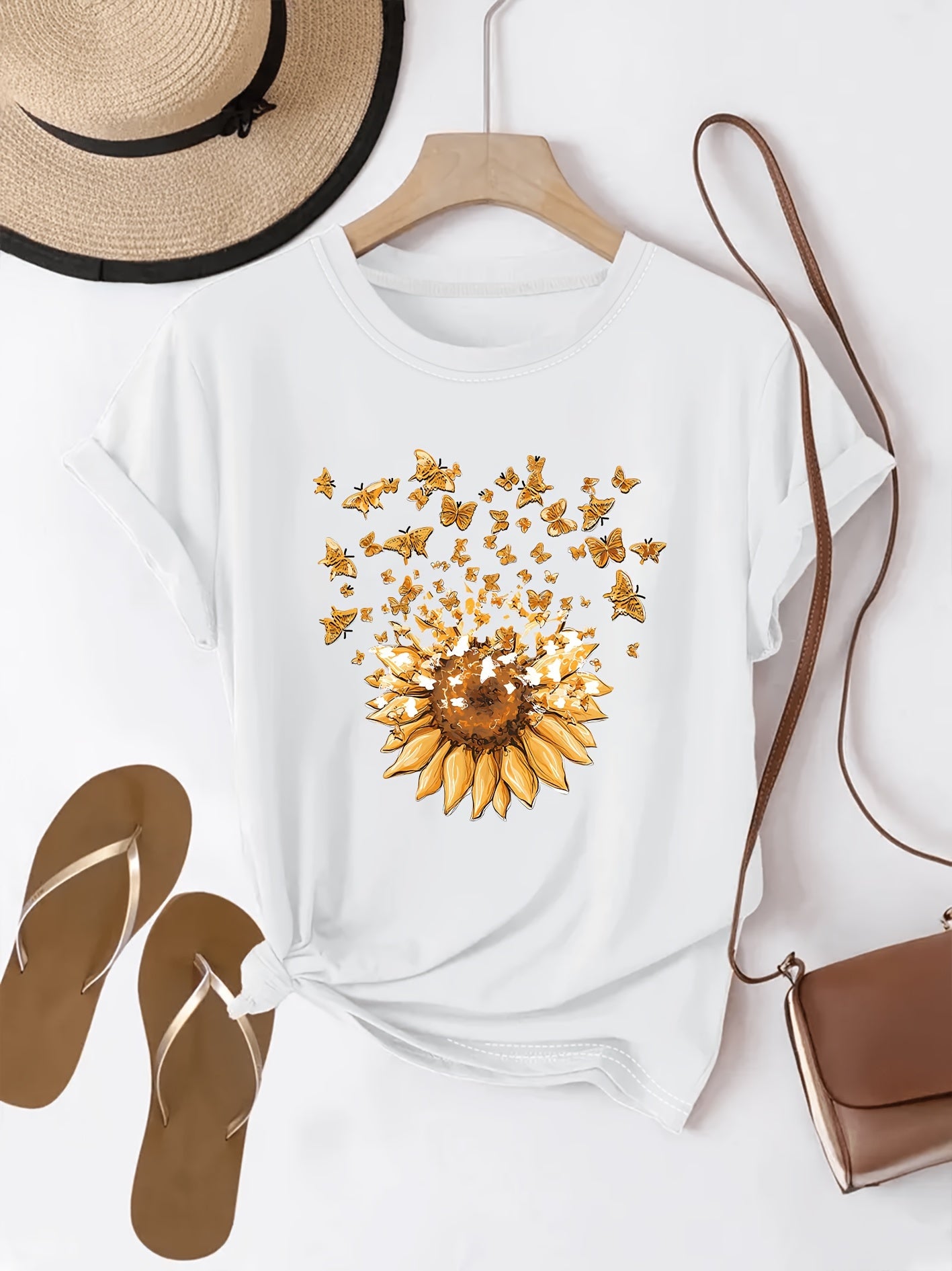 Women's casual style T-shirt with sunflower and butterfly pattern, trendy print for spring-summer