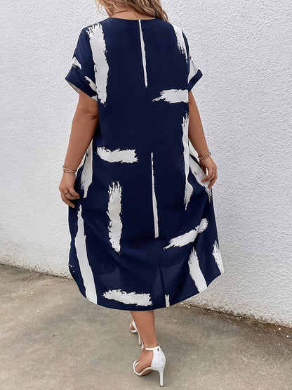 Elegancka tunika damska z artystycznym nadrukiem, styl casual chic