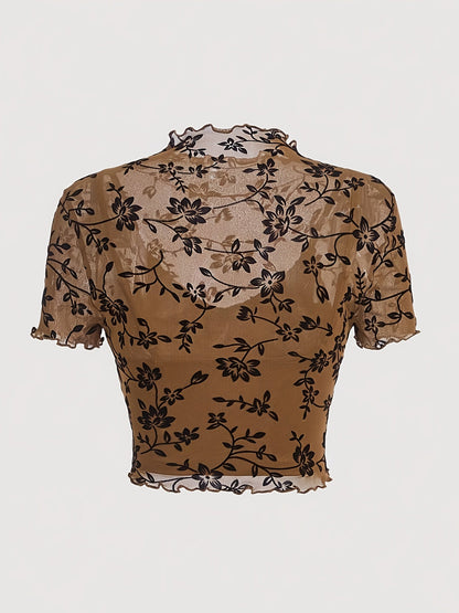 Elegant dame top med blomsterprint, transparent og med høj hals
