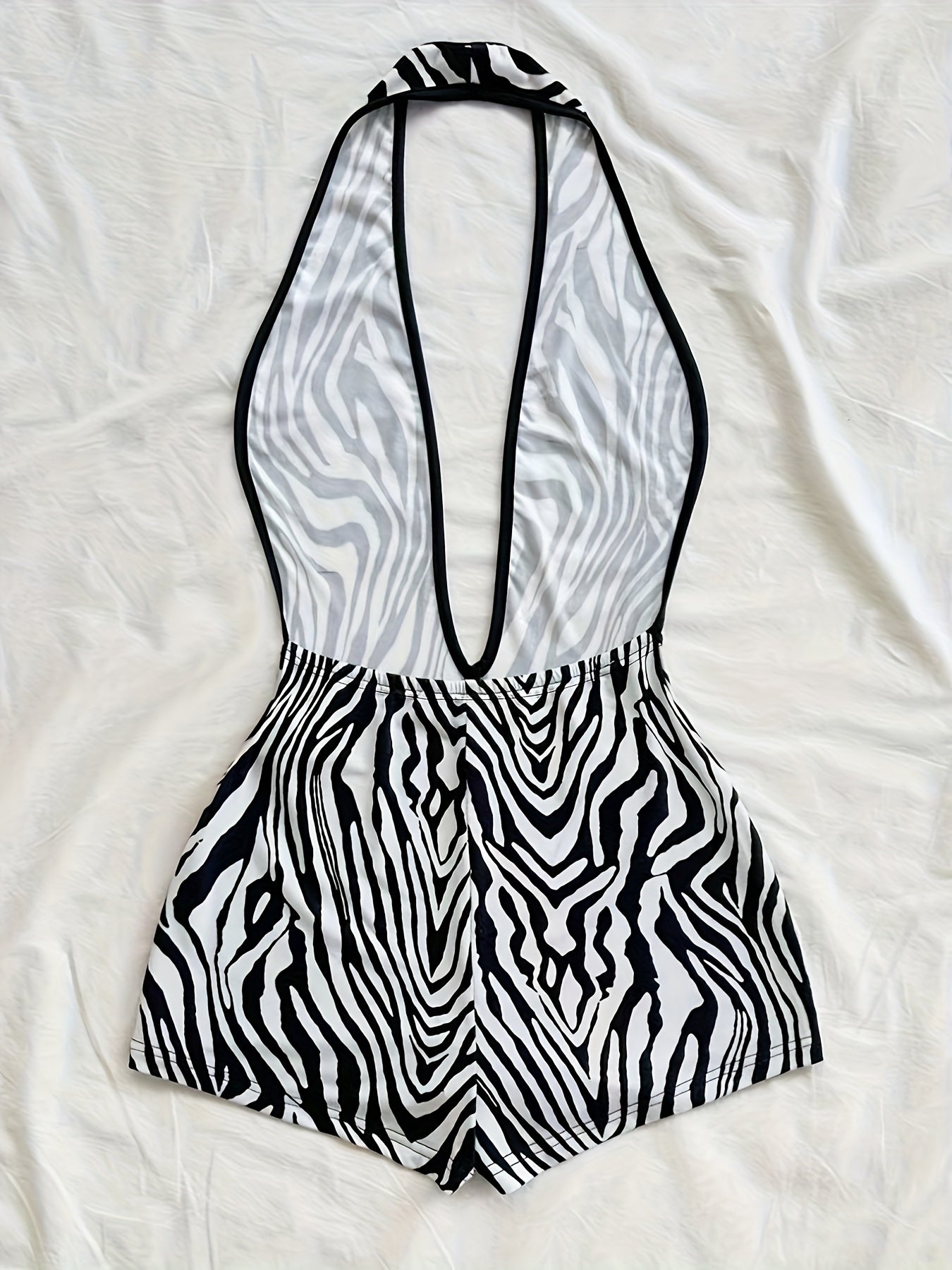 Tuta corta intera donna stile animalier, scollatura profonda, tendenza estate, ideale per spiaggia e vacanze