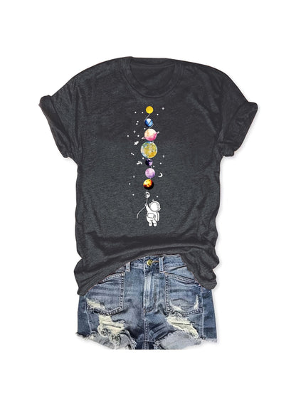 Women's casual style T-shirt with astronaut and planets design, space-inspired, ideal for science enthusiasts and urban fashion fans