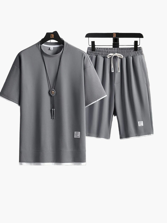 Completo uomo informale due pezzi maglietta larga e pantaloncini stile urbano ideale per relax e uscite