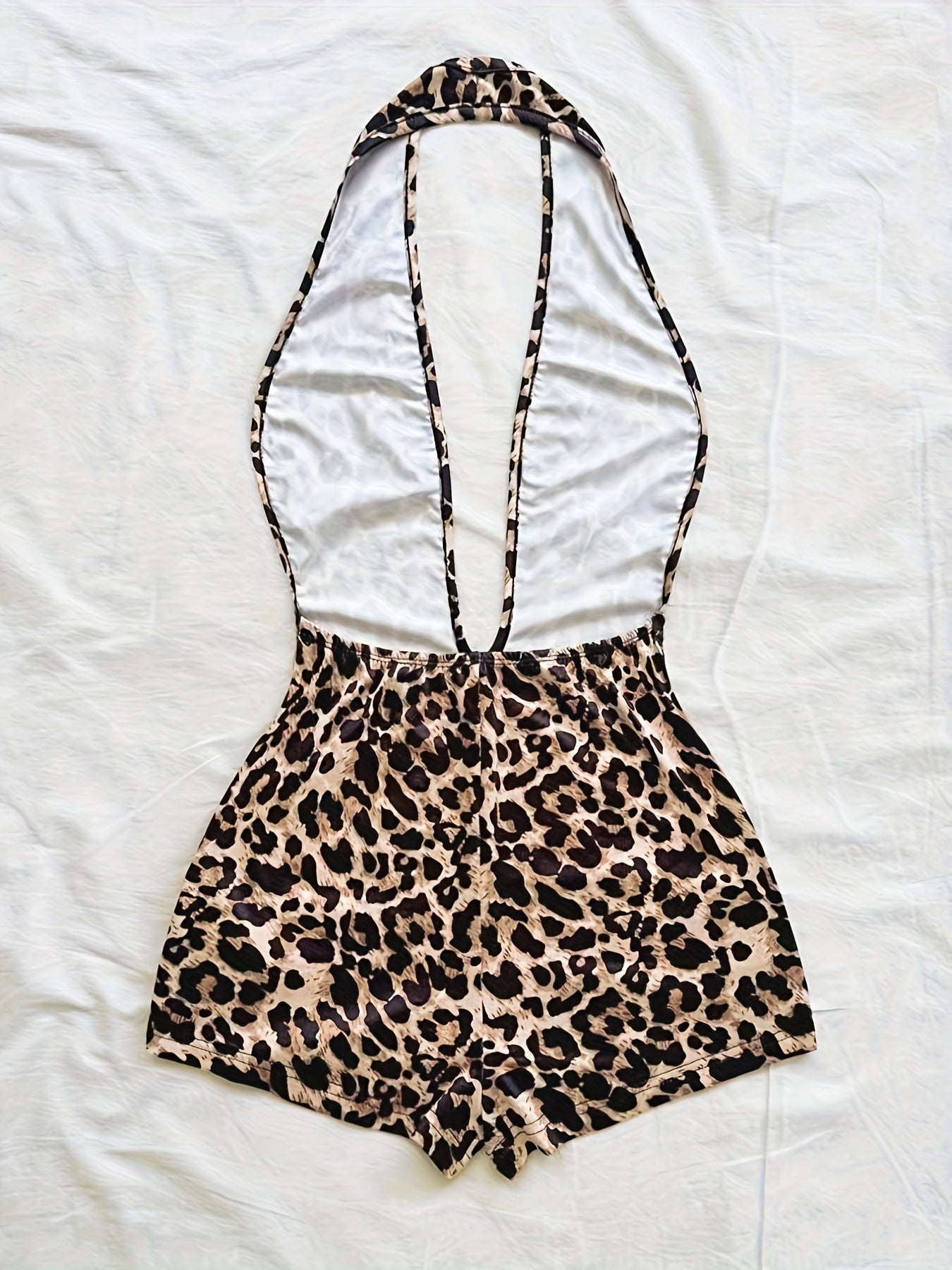 Tuta corta intera donna stile animalier, scollatura profonda, tendenza estate, ideale per spiaggia e vacanze