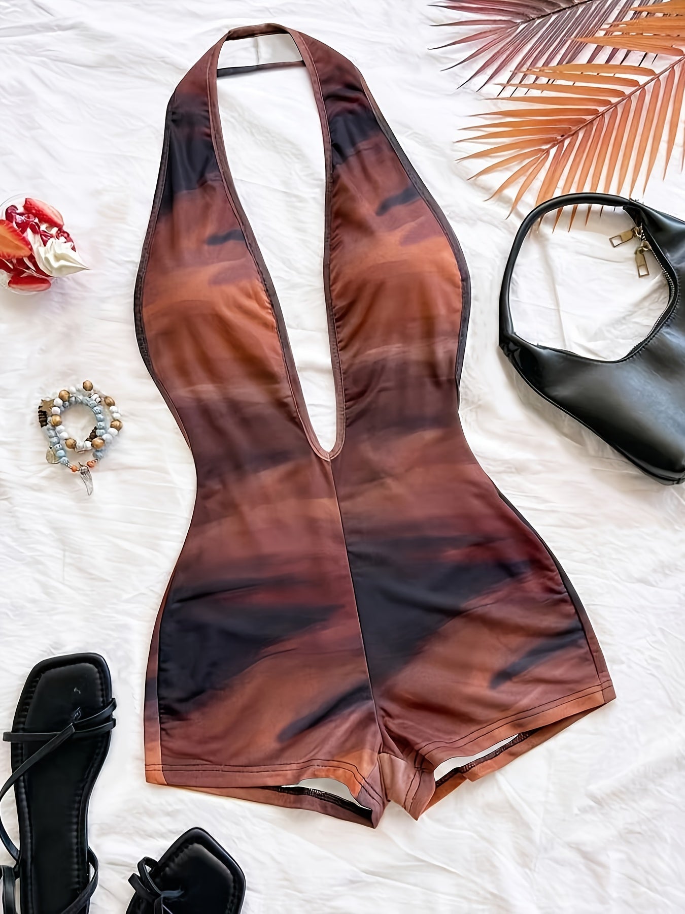 Tuta corta intera donna stile animalier, scollatura profonda, tendenza estate, ideale per spiaggia e vacanze