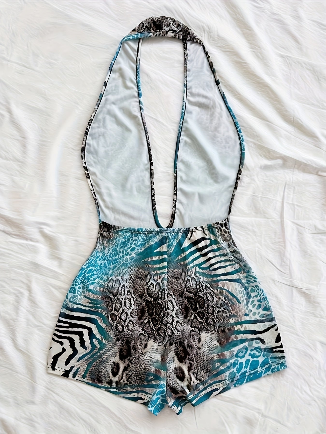 Tuta corta intera donna stile animalier, scollatura profonda, tendenza estate, ideale per spiaggia e vacanze