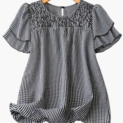 Blusa femminile a pois stile elegante con maniche corte e collo rotondo per l'estate