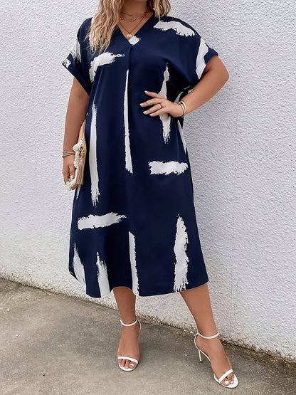 Elegancka tunika damska z artystycznym nadrukiem, styl casual chic
