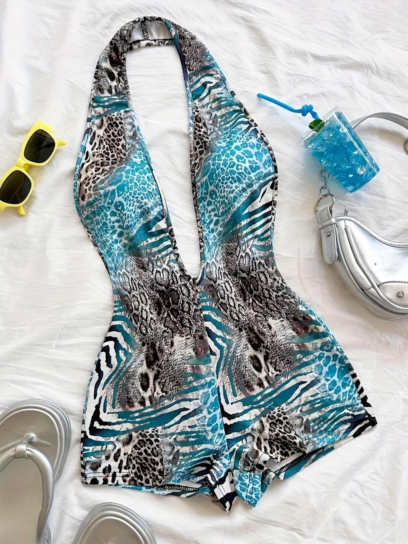 Tuta corta intera donna stile animalier, scollatura profonda, tendenza estate, ideale per spiaggia e vacanze