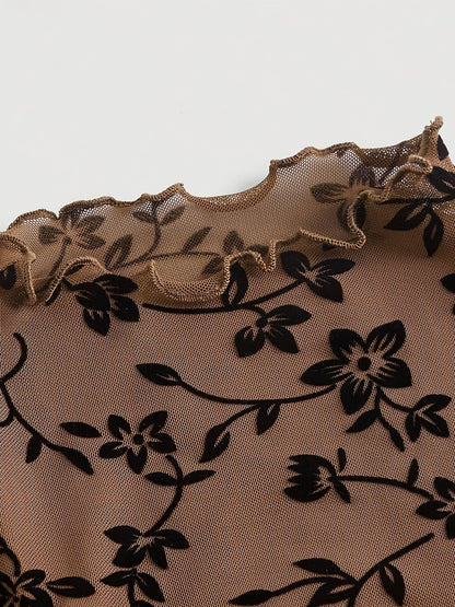Elegant dame top med blomsterprint, transparent og med høj hals