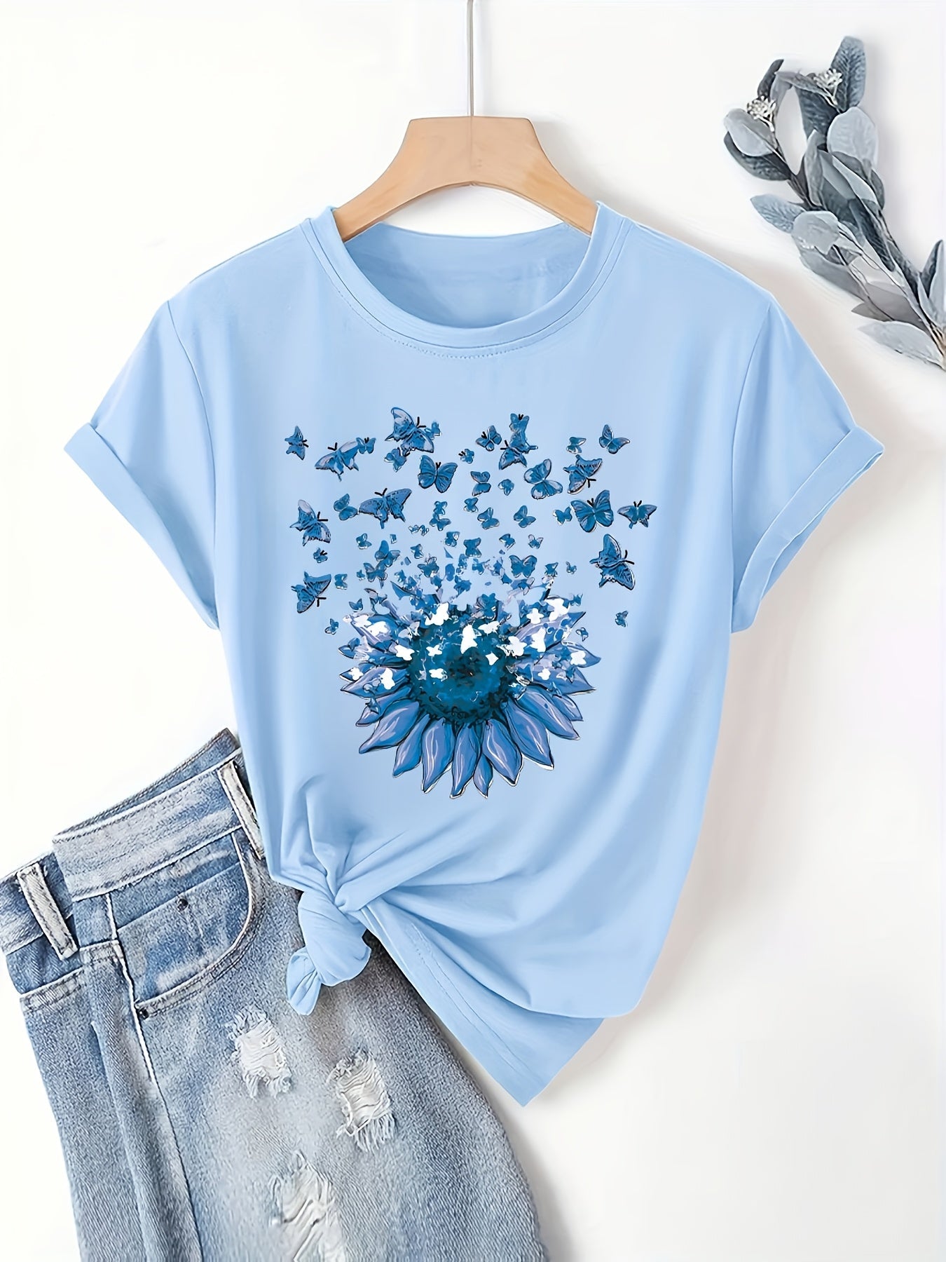 Women's casual style T-shirt with sunflower and butterfly pattern, trendy print for spring-summer