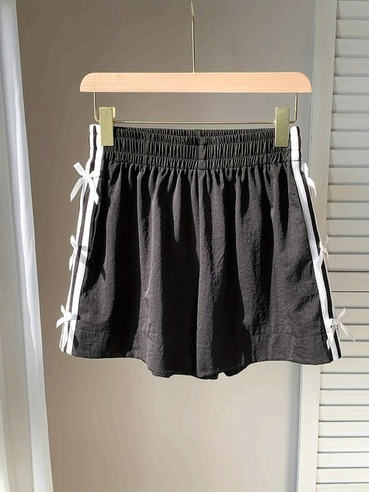 Women's casual holiday-style shorts with side knots and sporty stripes