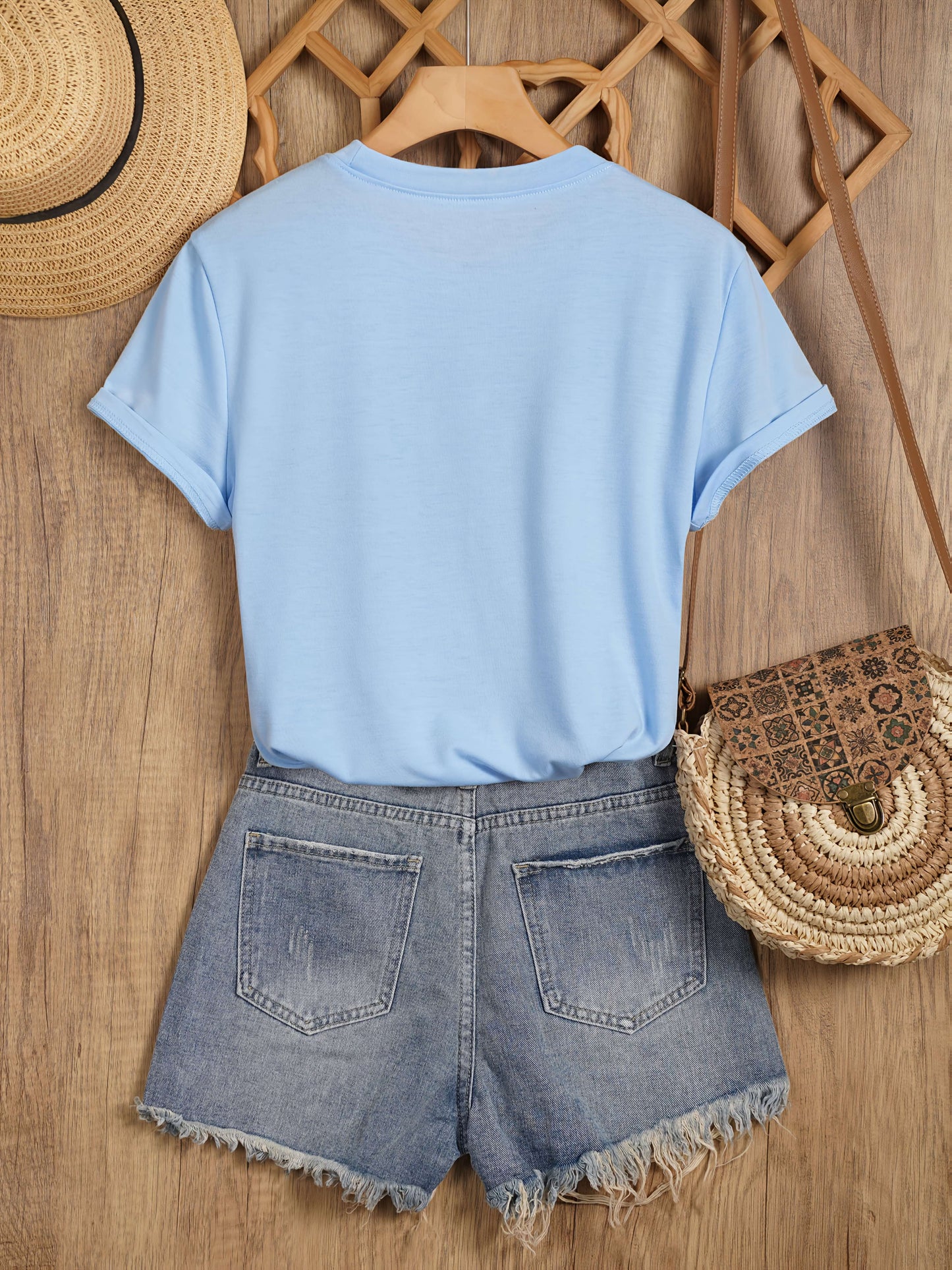 Women's casual style T-shirt with sunflower and butterfly pattern, trendy print for spring-summer