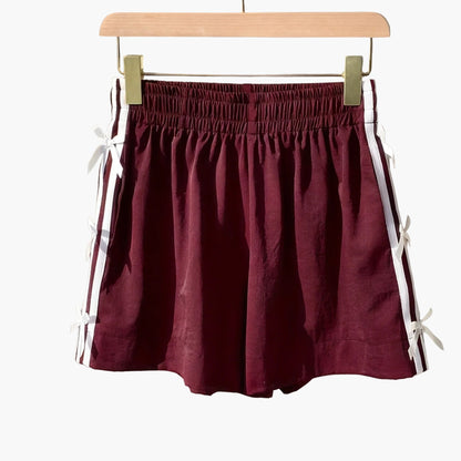 Top corto casual para mujer estilo vacaciones con nudos laterales y bandas deportivas
