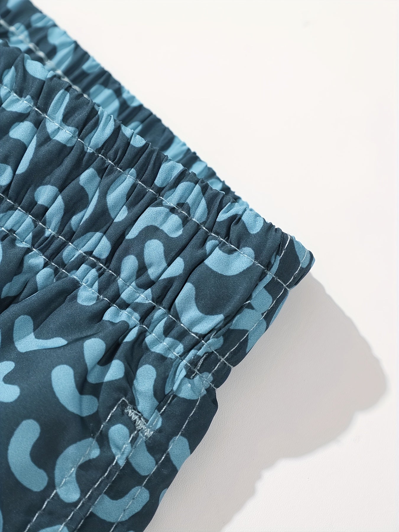 Short de bain homme style sportswear motif graphique pour plage et piscine