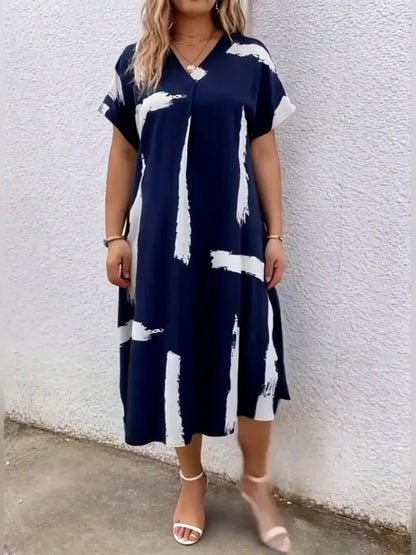 Elegancka tunika damska z artystycznym nadrukiem, styl casual chic